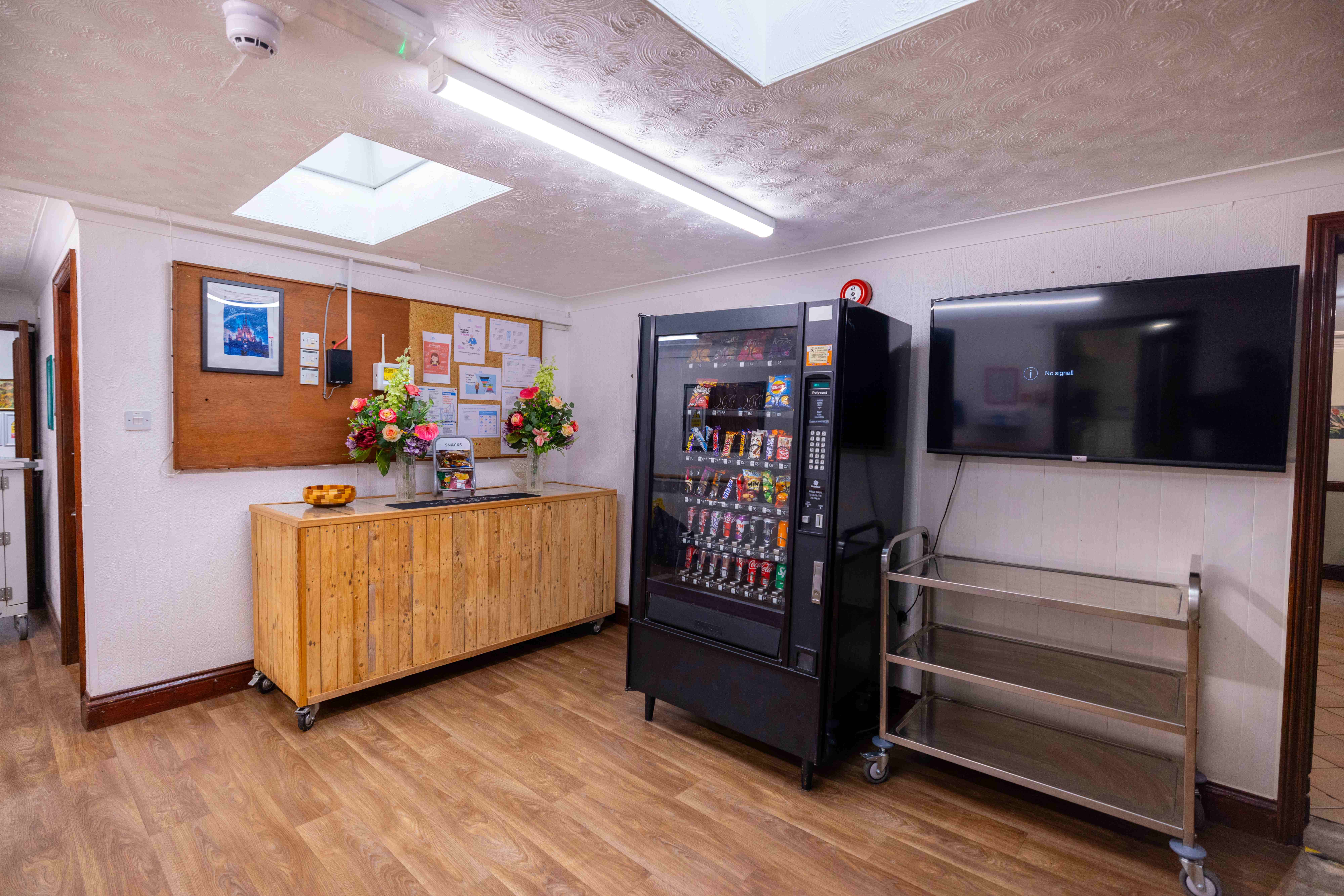 Entertainment and refreshment area with amenities and large screen TV